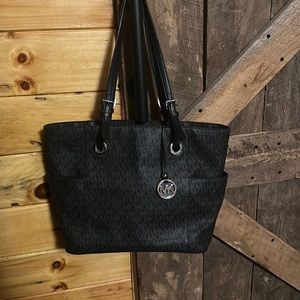 Black Michael Kors hand bag. In good condition.